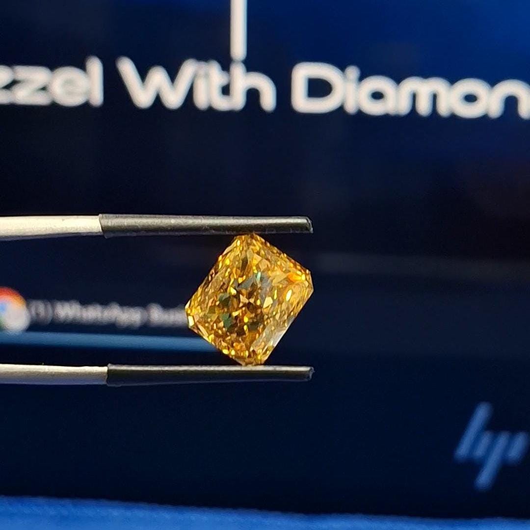 Radiant Cut Lab Grown Diamond: Fancy Vivid Yellow, VVS/VS, IGI Certified