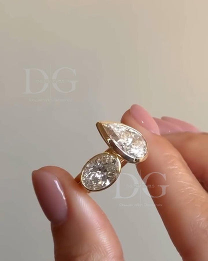 Bezel Set Toi et Moi Engagement Ring: Pear & Oval Lab Grown Diamond