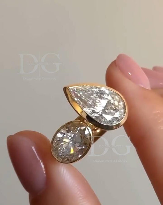 Bezel Set Toi et Moi Engagement Ring: Pear & Oval Lab Grown Diamond