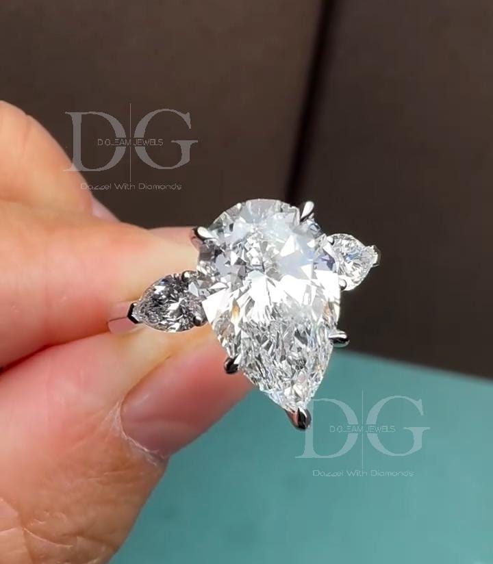 5.01 CT Pear Cut Lab Grown Diamond Three Stone Engagement Ring