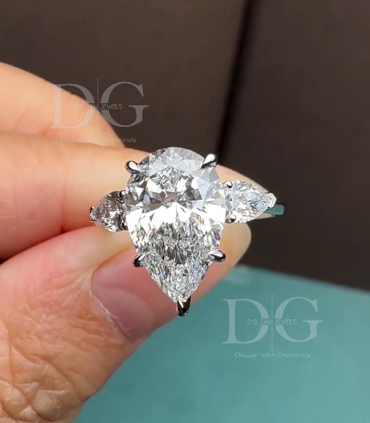 5.01 CT Pear Cut Lab Grown Diamond Three Stone Engagement Ring