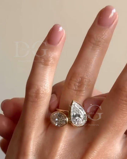Bezel Set Toi et Moi Engagement Ring: Pear & Oval Lab Grown Diamond