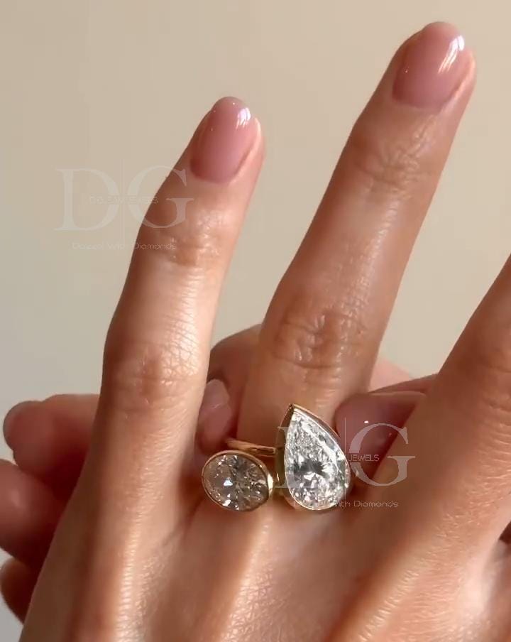 Bezel Set Toi et Moi Engagement Ring: Pear & Oval Lab Grown Diamond