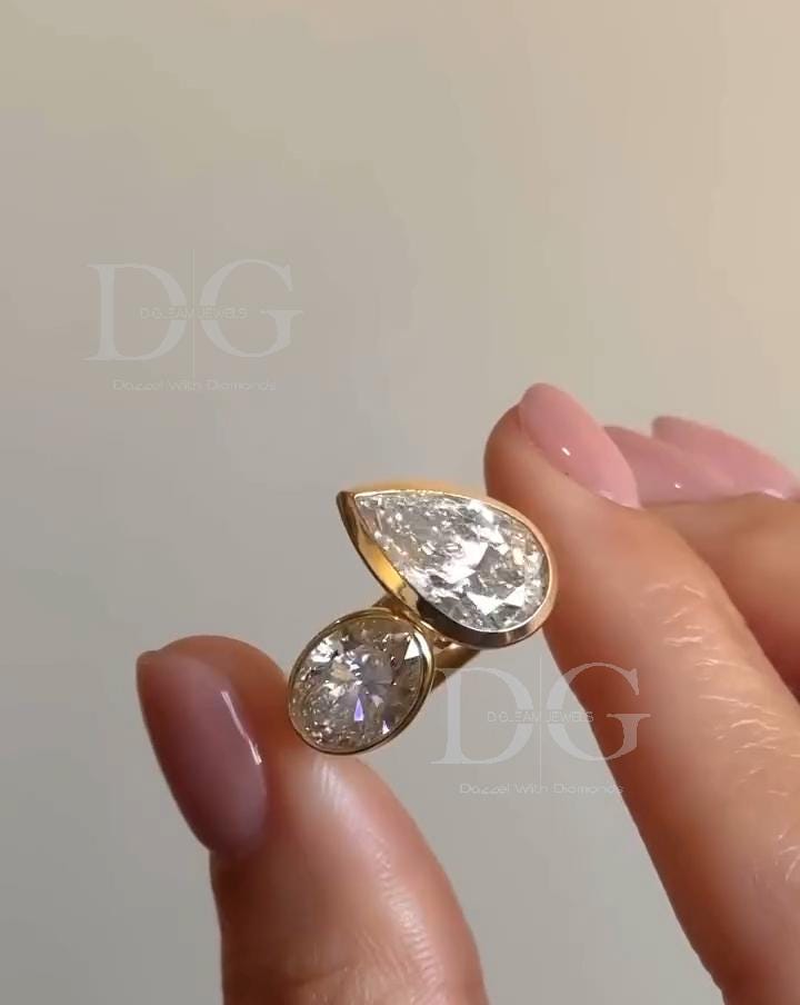 Bezel Set Toi et Moi Engagement Ring: Pear & Oval Lab Grown Diamond